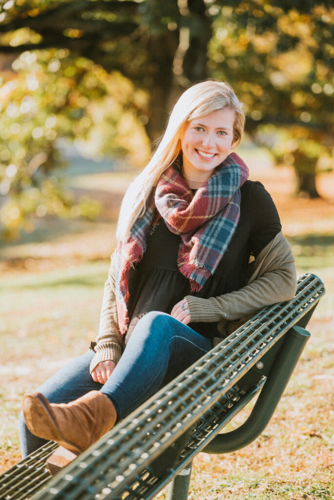 Senior portrait of a high school student surrounded by autumn trees in Fairfield County CT