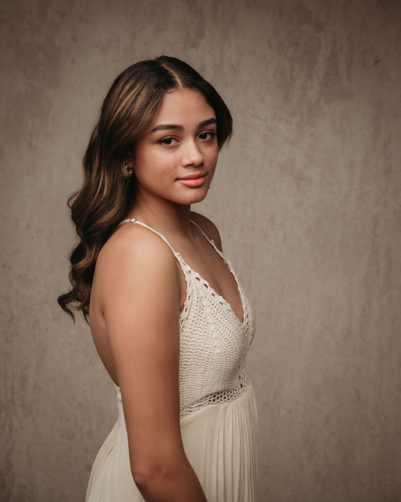 High school senior picture featuring clean studio backdrop in New Haven Connecticut